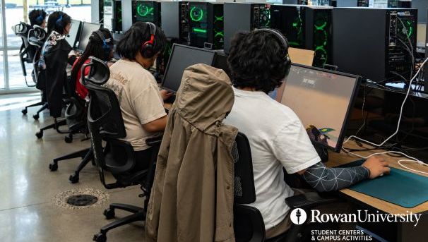 Student gamers at a row of computers.