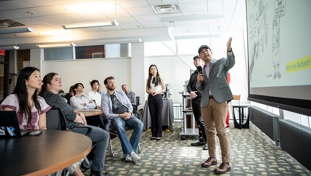 Student giving presentation in front of class