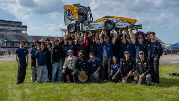 Berkeley Formula Racing team holding up their formula racing car