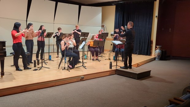 group of students playing flutes