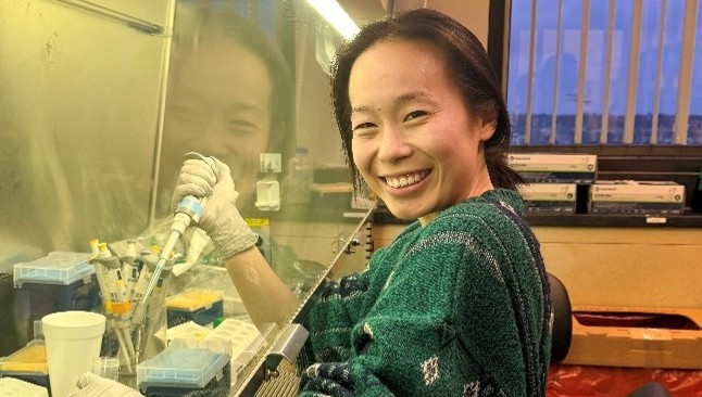 a Hopkins medical student performing tissue culture during a year of research