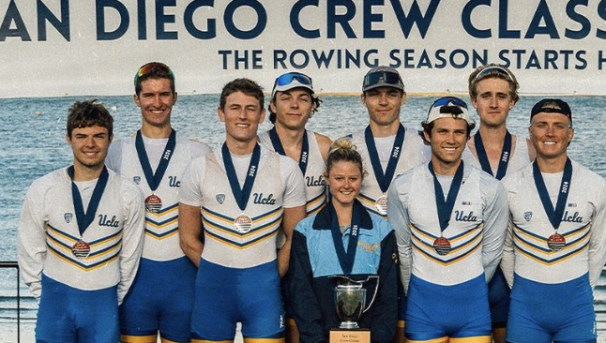 Men's Rowing Team photo Standing With a Trophy