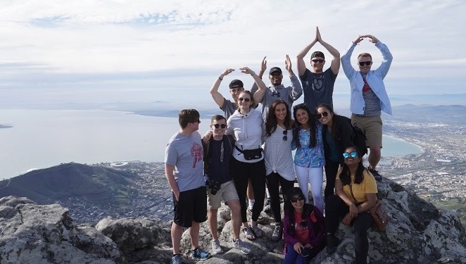 Ohio State Students doing O H I O with their arms in South Africa