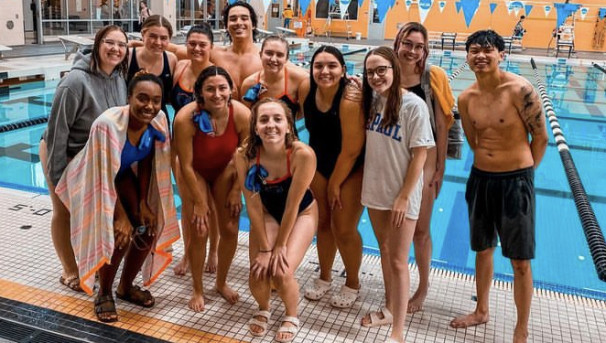 The DePaul Swim Club smiles for a team picture at the Purdue meet this past fall.