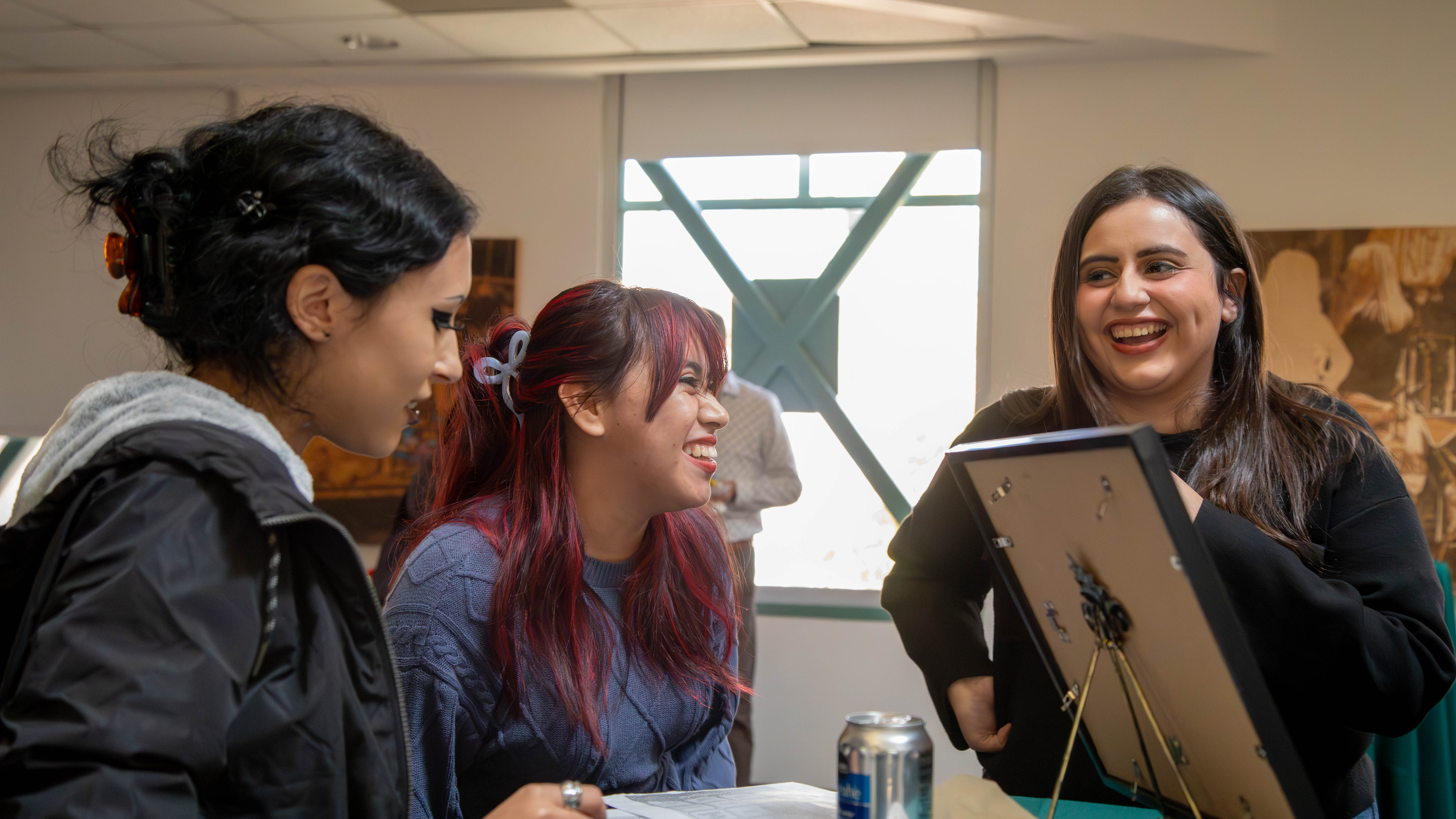Students gather at Matador statue for scholarship event recognizing academic achievement.