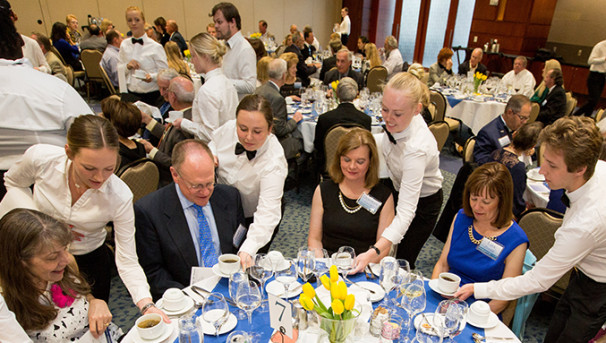 Students serving at the HRM Hughes Dinner