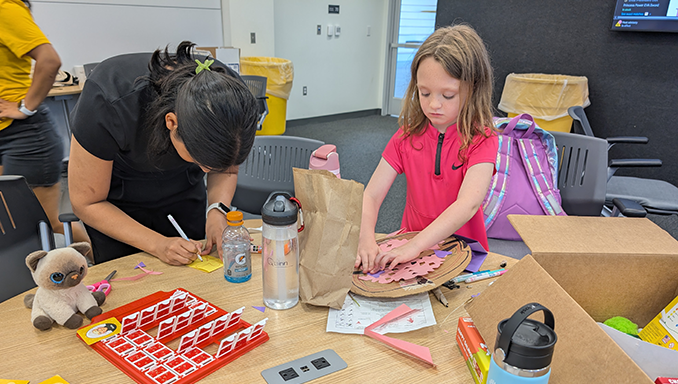 Student designing her own Viking shield.