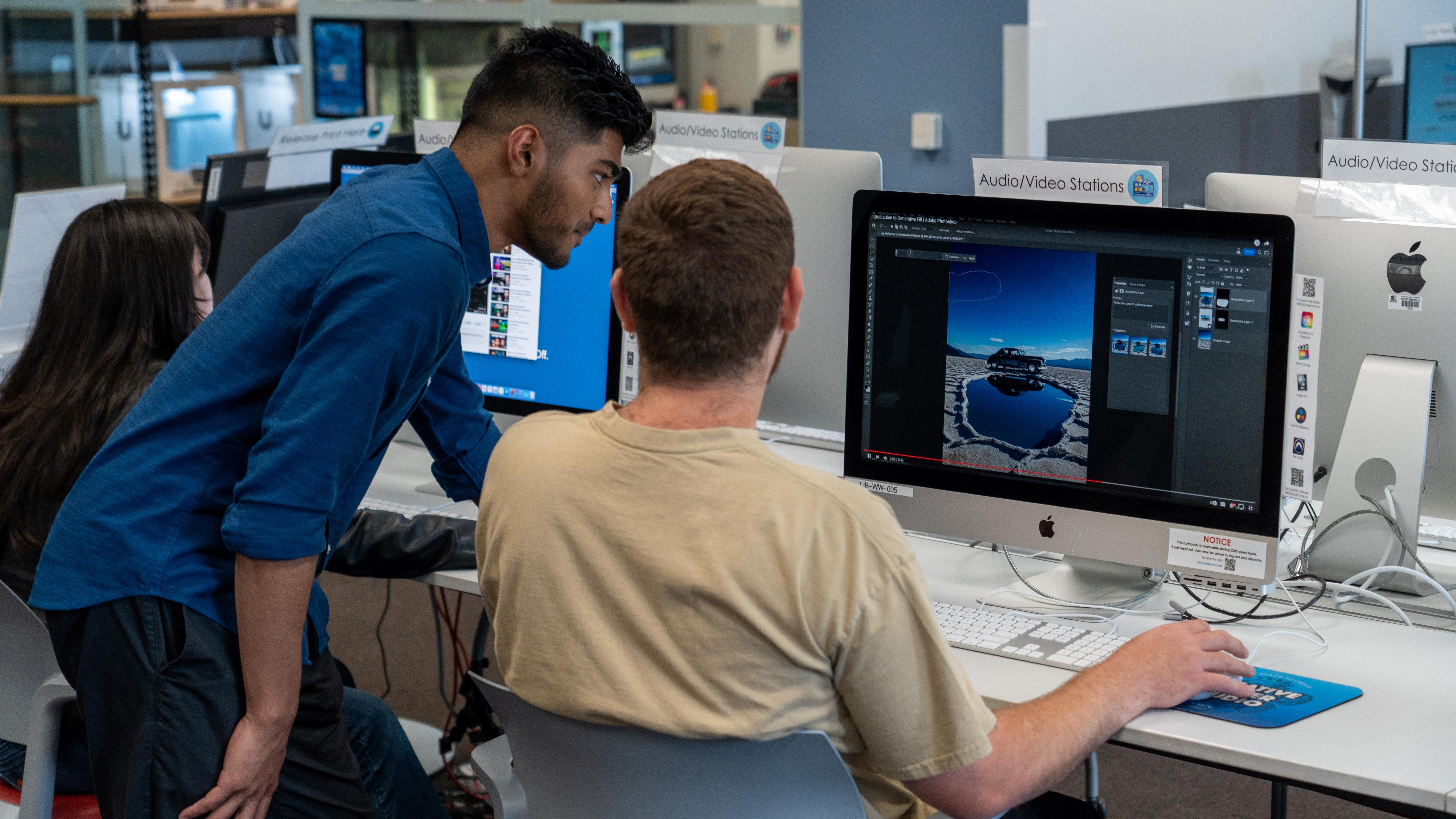 Students refine visuals using industry-standard editing tools at AV workstations.