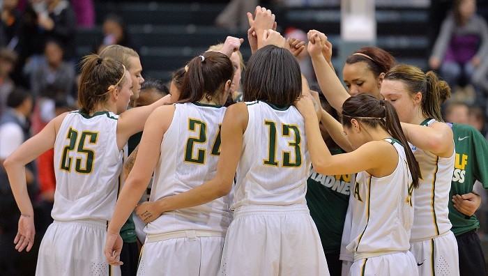 Seawolves work together. Seawolf Women's Basketball team huddle