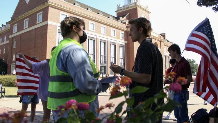 Miles Anderson (Treasurer) discusses issues with one of the pro-palestine protesters.