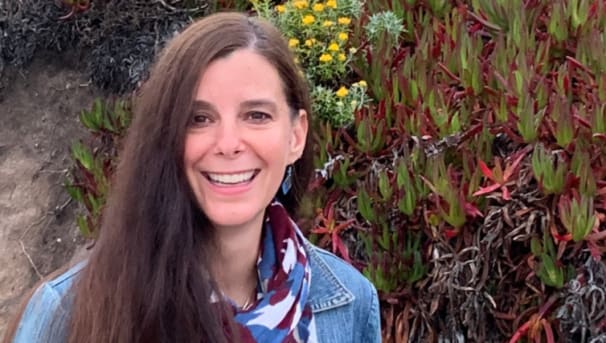 Krista Hays smiling while standing outside