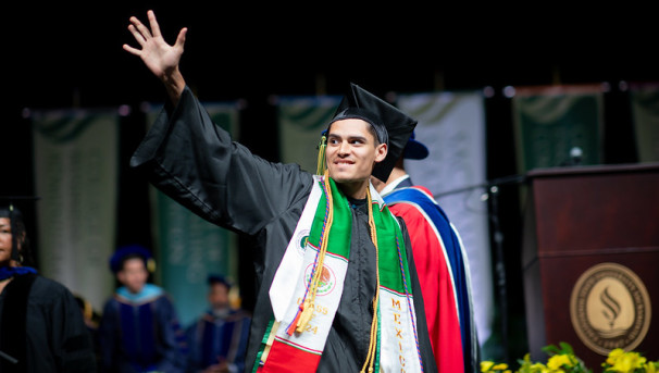 Graduate waving