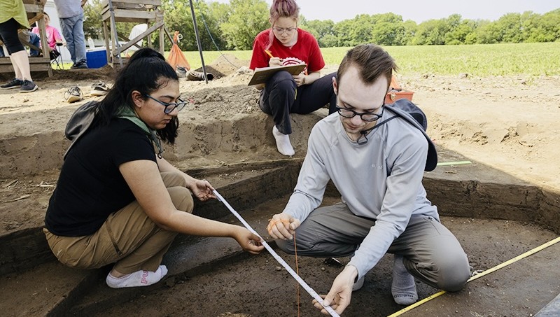 Archaeology students mapping an excavation