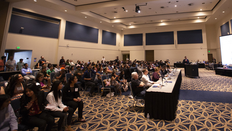 Titan Fast Pitch crowd and judges watching pitches