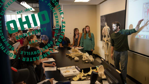 OU professor standing in front of classroom with students listening