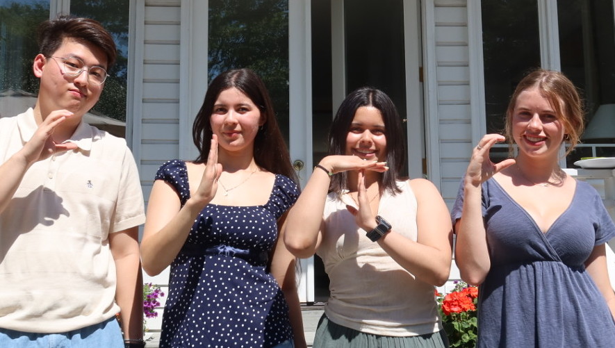 26-27 CITC Directors at the Annual BBQ spelling out "CITC" with their hands.