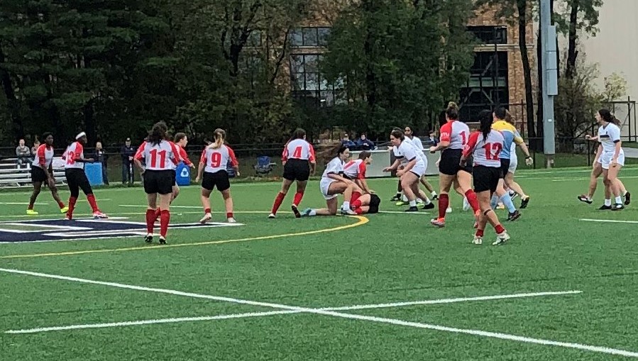 The Women's Club Rugby team in the middle of a game
