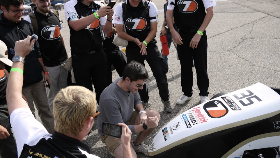 Team celebrates after passing all technical inspections at FSAE international for the first time