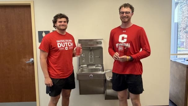 Picture of Central Students in front of a water filling station