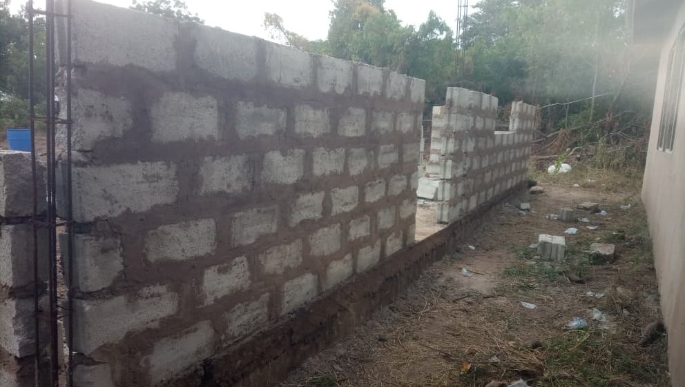 The first wall of the new clinic being constructed.