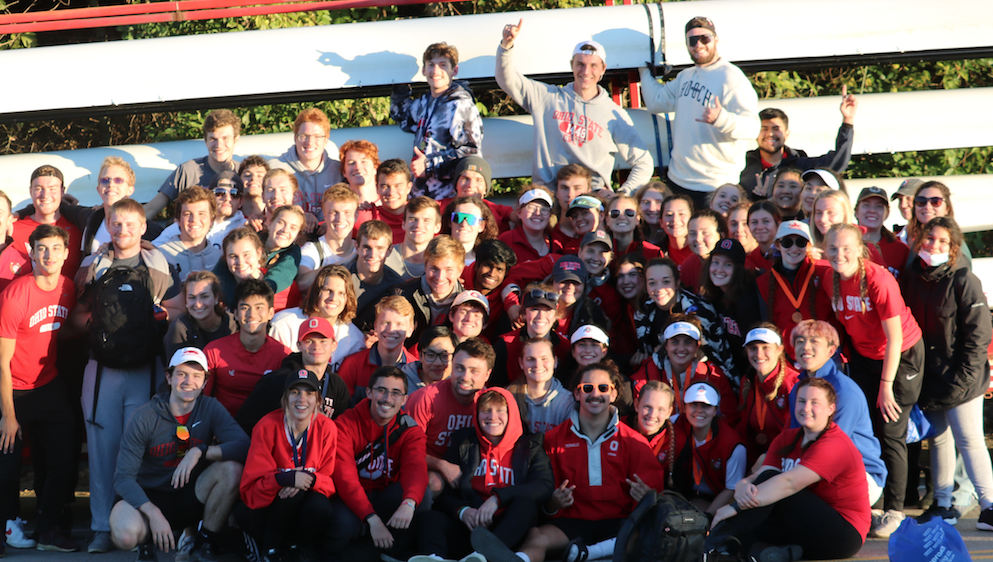 Ohio State crew club team members rowing during the sunrise