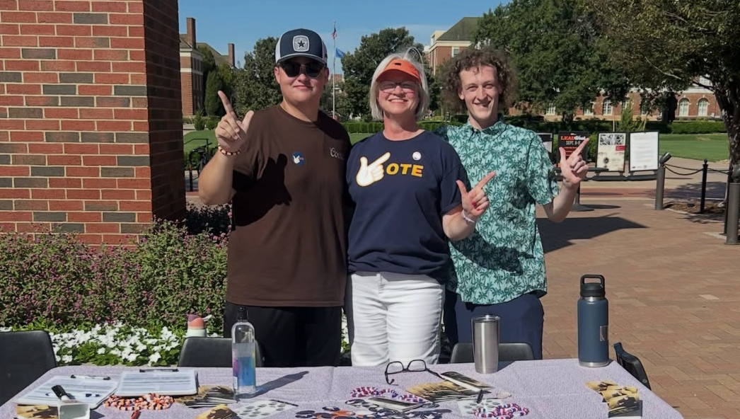 Pokes in Politics help students register to vote with Representative Trish Ranson.