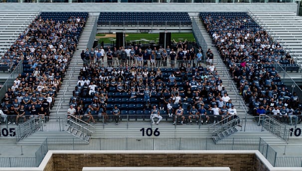 Monmouth University student-athletes seated in Kessler Stadium