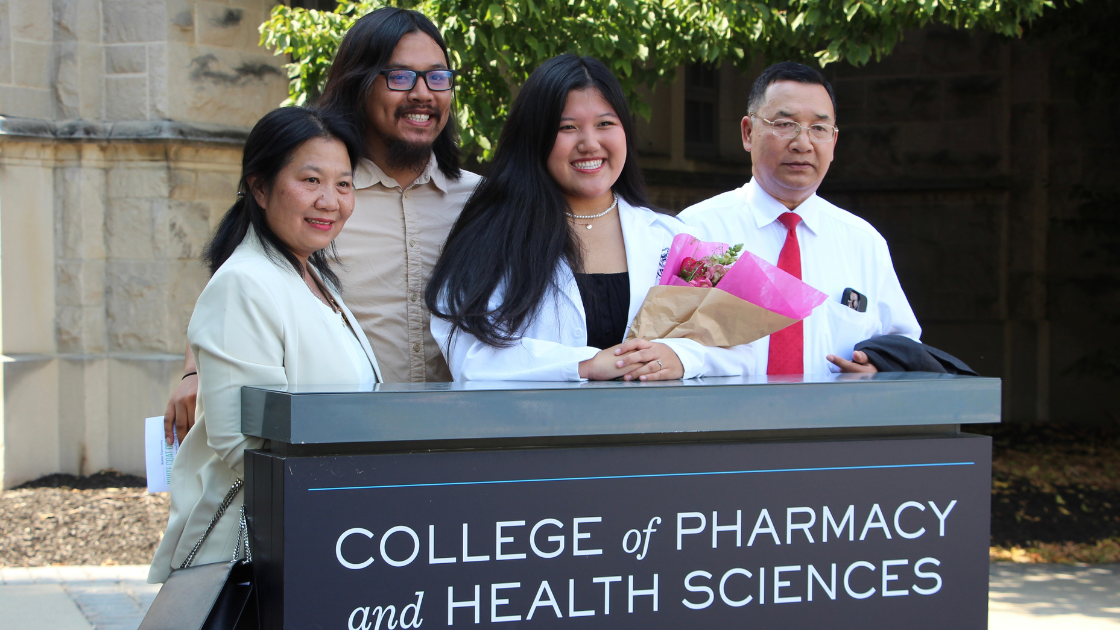Student gathered with family after the White Coat Ceremony