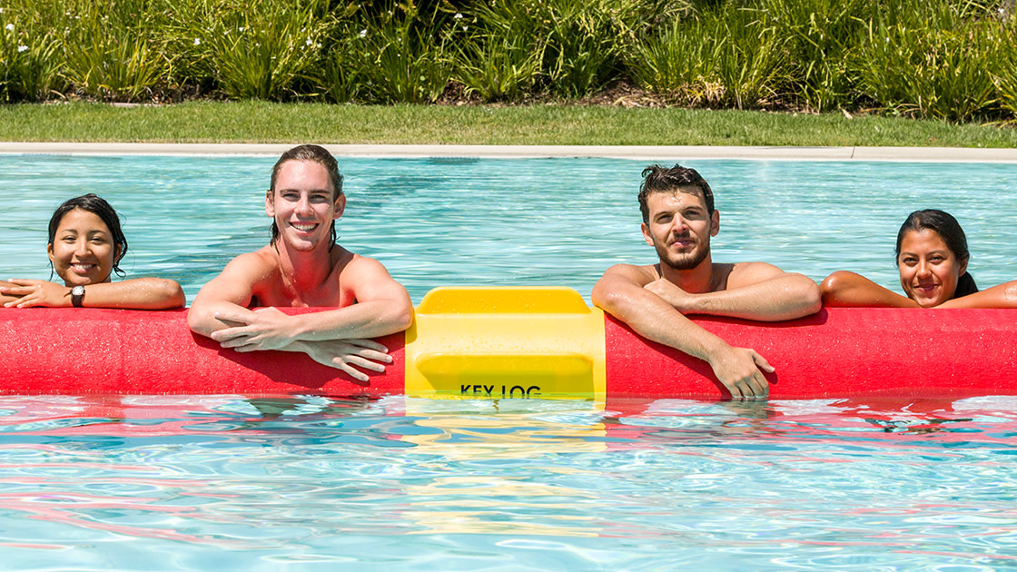 Four students in a pool