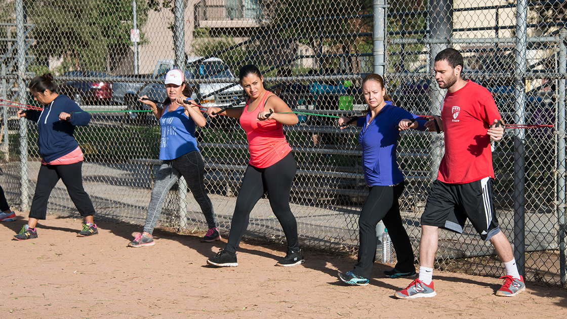 Community members engage in mindful movement to support health and stress relief.