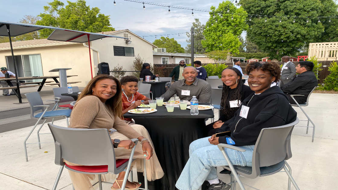 Black Alumni Association members gather at outdoor CSUN alumni event.
