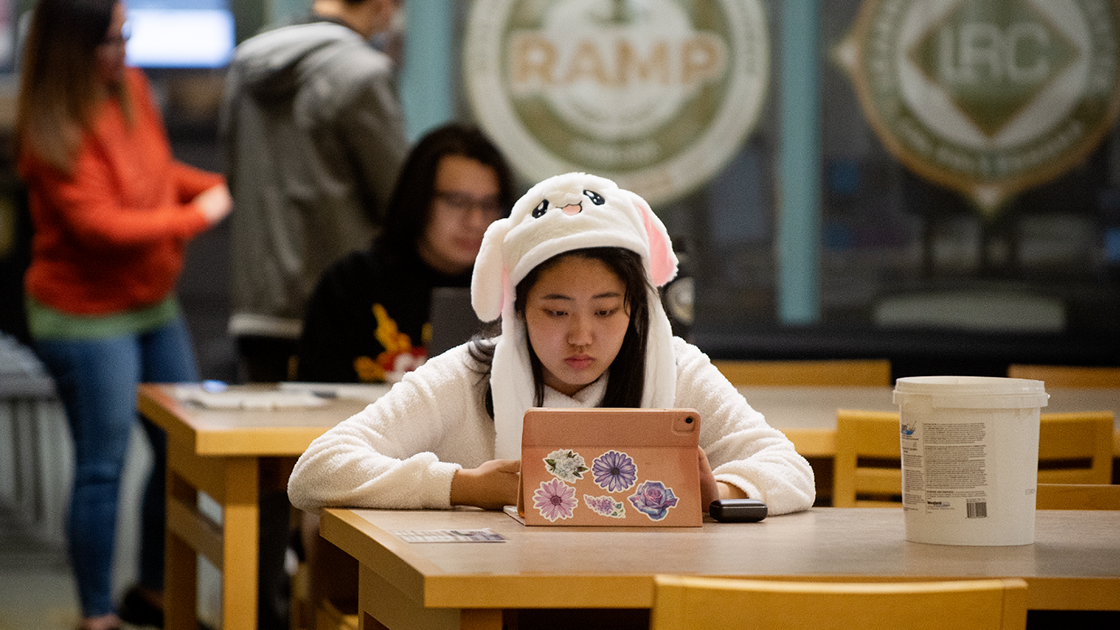 Student Studying in Front of RAMP & LRC