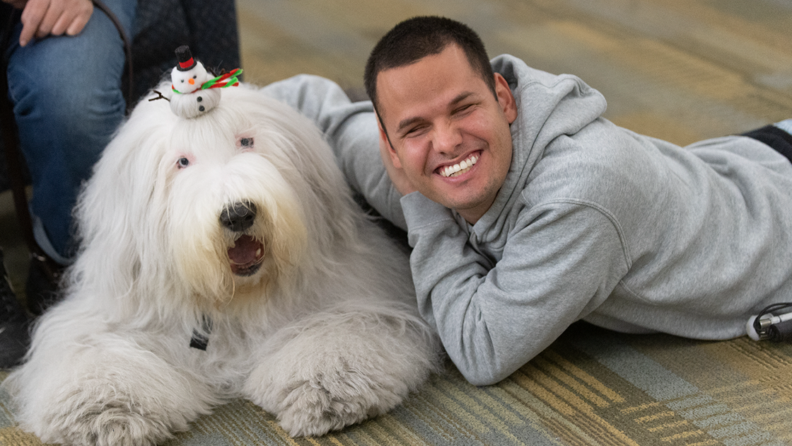 Student with Visiting Therapy Dog