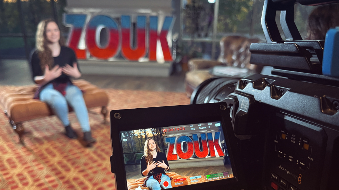 Camera recording woman sitting