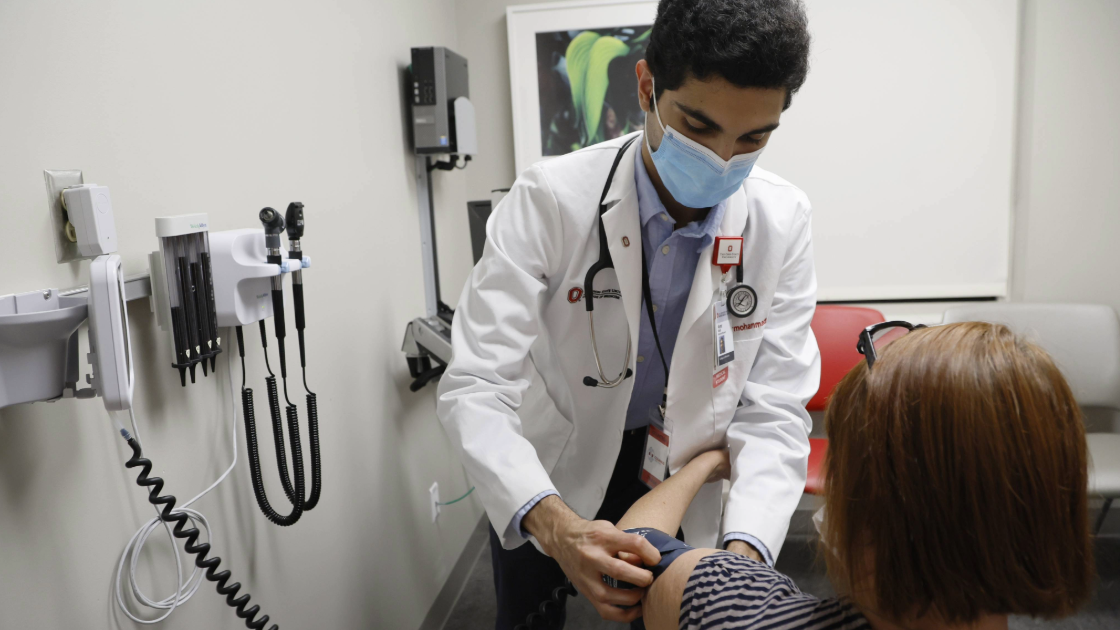 Medical Student Taking Blood Pressure