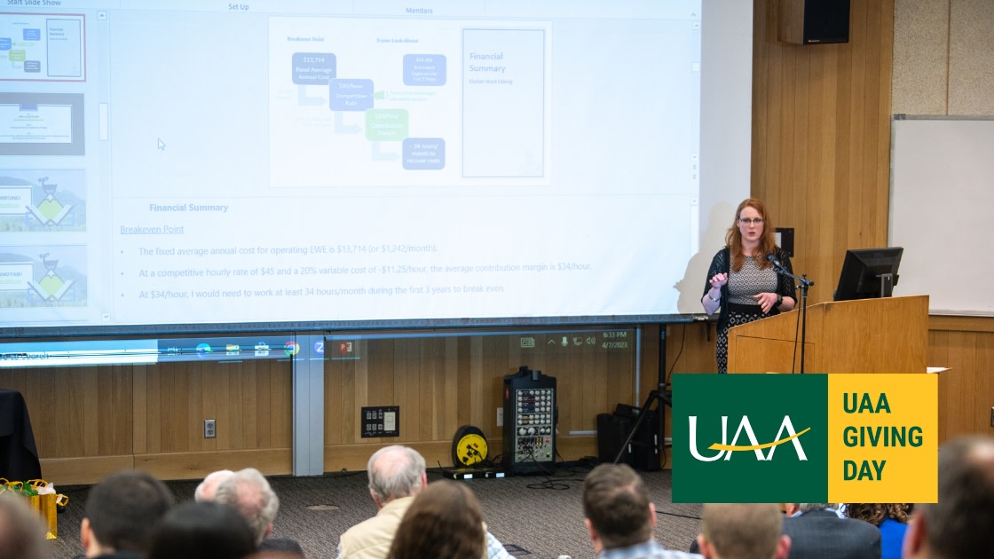 Competitor pitches a business at the Perfect Pitch Business Plan Competition Finale in Rasmuson Hall