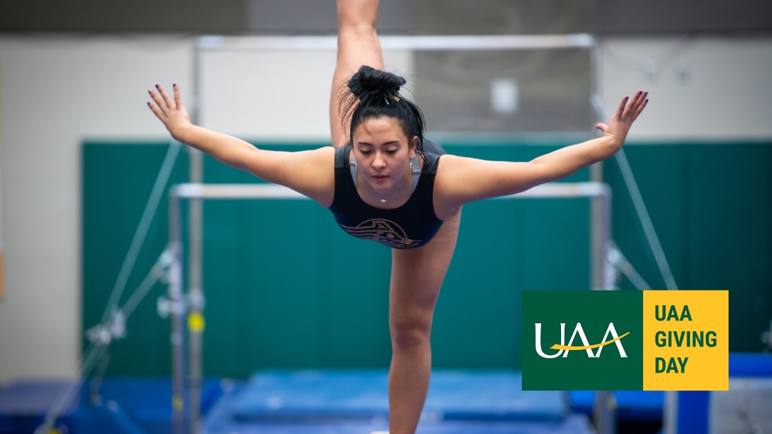 Seawolf Gymnastics team member on the balance beam at UAA's Alaska Airlines Center.