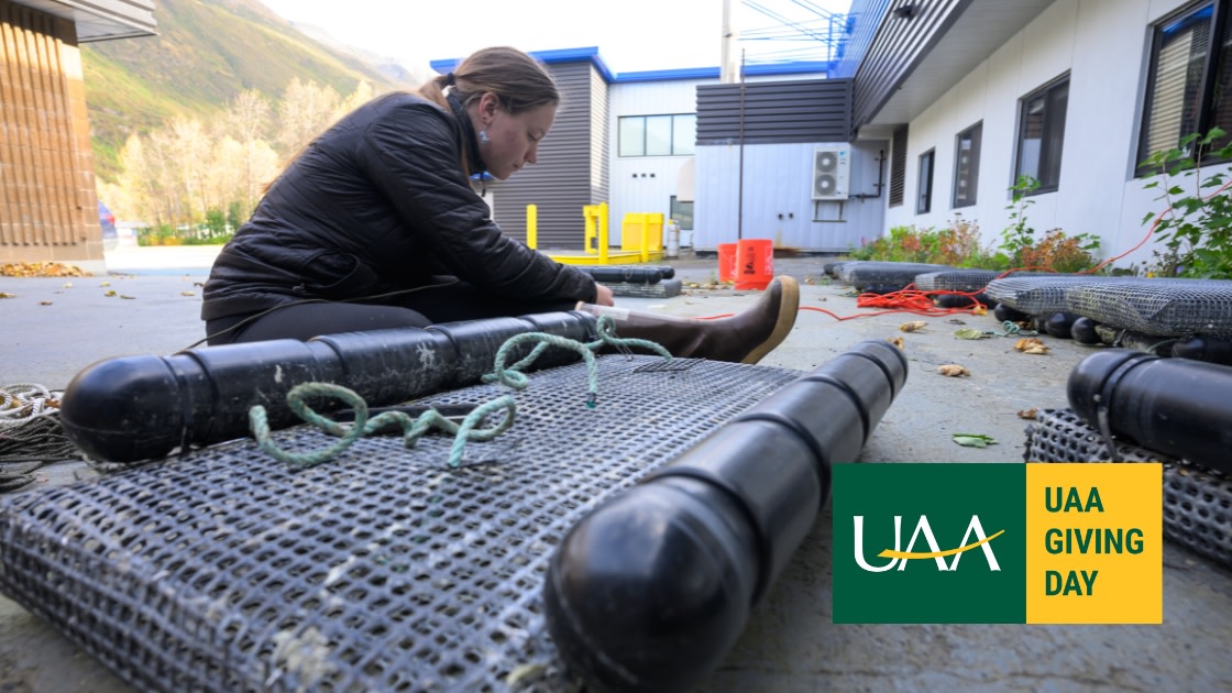 Marine Natural Sciences student sets up oyster baskets for a mariculture research project