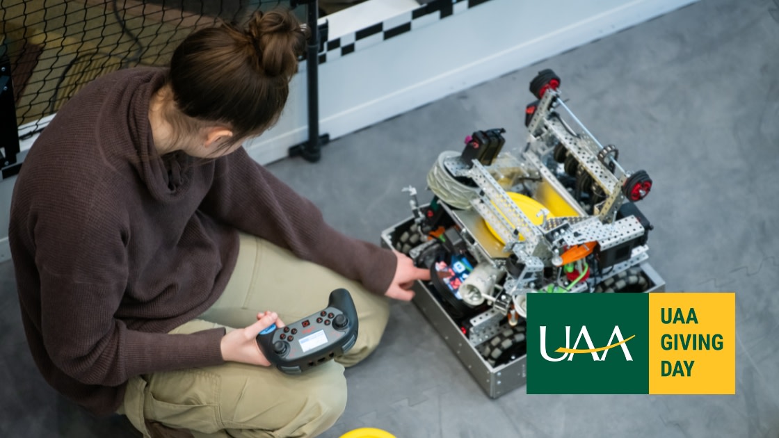 UAA Student prepares robots during the Alaska VEX U Live Remote Skills Competition