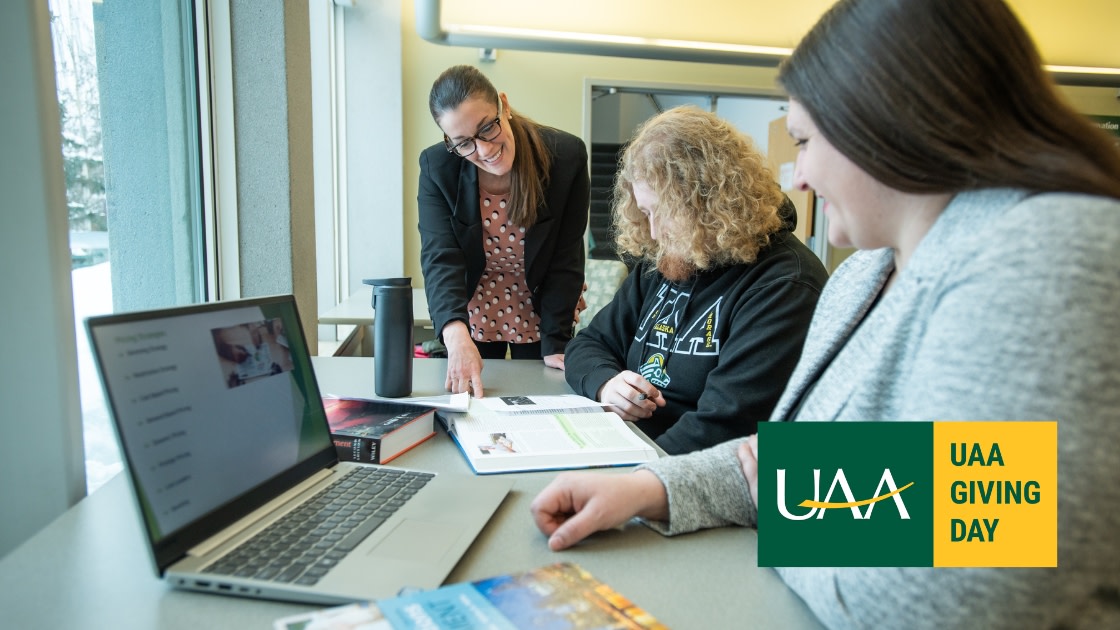 Amy Green, Professor of Hospitality Administration, talks with students in Rasmuson Hall