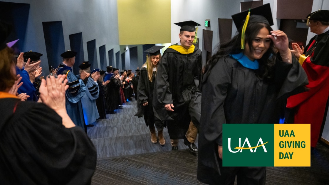Graduate degree recipients exit UAA's Fall 2024 Graduate Degree Hooding Ceremony
