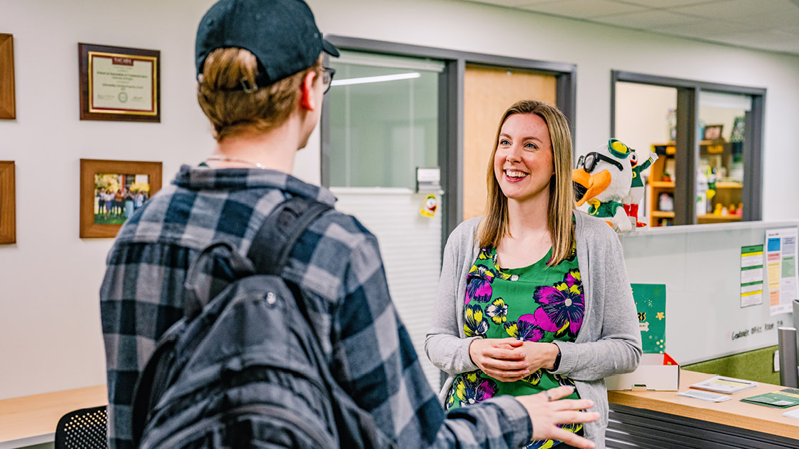 An SOJC students speaks with Rachel Allen, UO SOJC Associate Director of Student Services