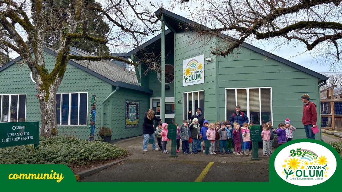 Olum Center building with children on a rainy day walk