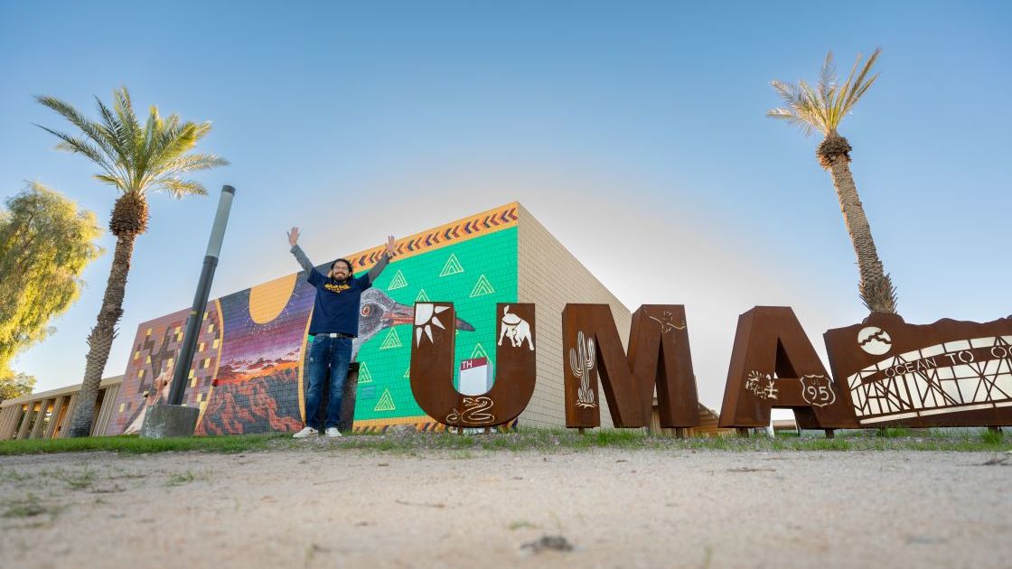 Student posing as the "Y" in Yuma.