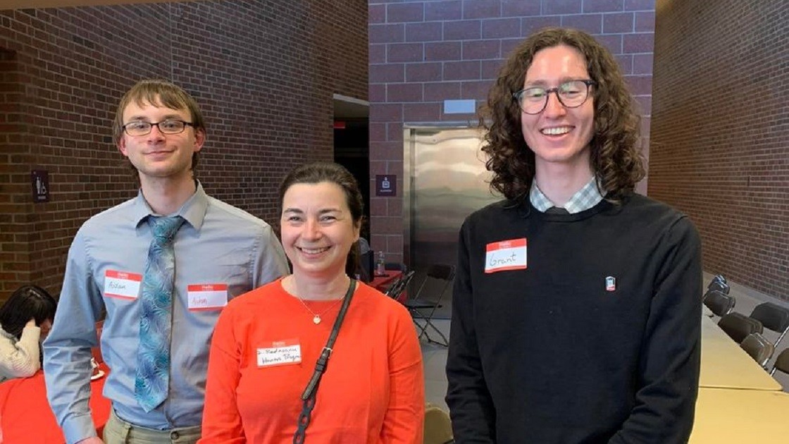Students Aidan Bengford and Grant Goral with honors director Dr. Radasanu