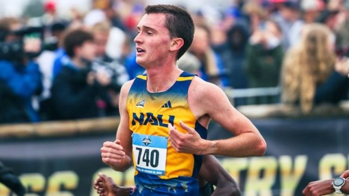 Male cross country runner mid-run at NAU