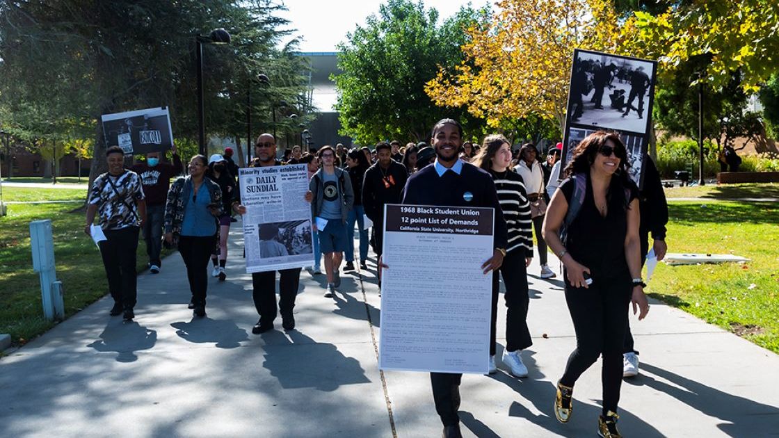 Group of students march in activism on campus.