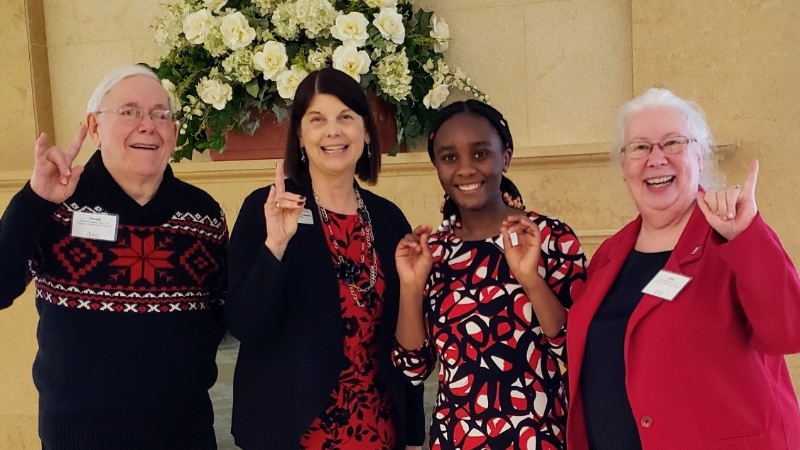 President Freeman, student Merveille Muyizere, and The Shearers