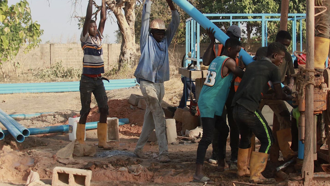 Individuals assisting with a construction site