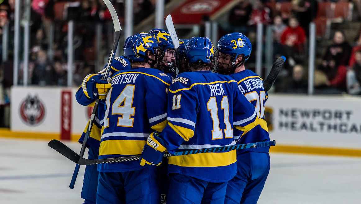 Alaska Nanooks huddled up on-ice at at 2023024 season away game.